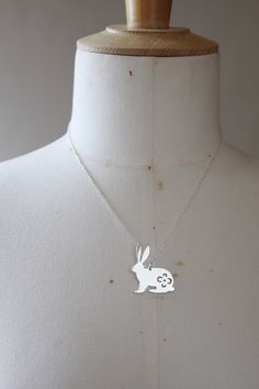 Lola&Cash loves bunnies, you may have noticed ❤ -- d e t a i l s -- -rabbit pendant measures 2.5cm tall -hand sawn from sterling silver, with a pretty floral design hand pierced on the bunny's body -completed in a mirror finish -includes a 45cm silver chain -All Lola&Cash jewellery will arrive in gift giving mode -------------------------------- Please Note - Made to order I require up to 2 weeks for manufacturing jewellery orders & send out email notifications once your order has be Silver Bunny Design Jewelry For Gifts, Silver Bunny Design Jewelry Gift, Silver Jewelry With Bunny Design For Gift, Giraffe Jewelry, Rabbit Necklace, Rabbit Jewelry, Hand Piercing, Bunny Necklace, Rabbit Necklaces