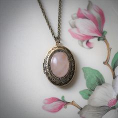 Stone Oval Vintage Style Locket Necklace in Rose Quartz or Rhodonite - Etsy Rose Quartz Locket, Vintage Pink Oval Pendant Jewelry, Vintage Oval Cabochon For Jewelry Making, Nickel-free Oval Necklace For Wedding, Nickel Free Oval Necklace For Wedding, Nickel-free Oval Wedding Necklace, Oval Cabochon Brass Necklace, Cameo Oval Pendant Jewelry Gift, Victorian Locket Necklace With Oval Pendant