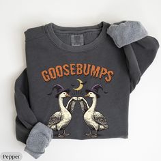 Comfort Colors® Silly GooseSweatshirt, Goose Bumps Shirt, Halloween Silly Goose Sweatshirt, Silly Goose Sweatshirt,Best Girly Halloween Gift 🍓Comfort Colors 1566 Unisex Sweatshirt🍓 💕 PRODUCT DETAILS 💕 - 80% ring-spun cotton, 20% polyester - Medium-heavy fabric (9.5 oz /yd² (322.1 g/m - Relaxed fit - Sewn in twill label 💕 CARE INSTRUCTIONS 💕 - Machine wash: cold (max 30C or 90F) - Do not bleach - Do not tumble dry - Do not iron directly on design - Do not dryclean. 🍓If you have any questions please feel free to ask me🍓 Silly Goose Sweatshirt, Goose Sweatshirt, Goose Bumps, Girly Halloween, Silly Goose, On Design, Halloween Gift, Heavy Fabric, Halloween Gifts