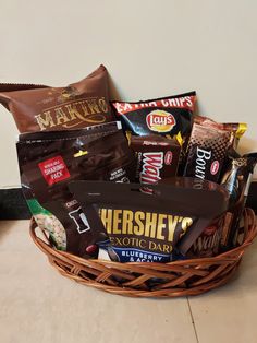 a basket filled with chocolates and candy bars