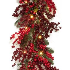 a christmas tree with red berries and lights