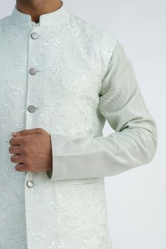 Light mint chanderi bundi jacket with floral and thread hand embroidery. Comes with off-white pant and a kurta. - Aza Fashions Chanderi Nehru Jacket With Chikankari Embroidery For Reception, Chikankari Embroidery Chanderi Nehru Jacket For Reception, Chikankari Embroidery Nehru Jacket For Reception, Designer Nehru Jacket With Chikankari Embroidery And Stand Collar, Designer Nehru Jacket With Cutdana For Spring, Chanderi Nehru Jacket With Cutdana For Reception, Transitional Chanderi Nehru Jacket For Reception, Nehru Jacket With Floral Embroidery For Reception And Festivals, Spring Designer Nehru Jacket With Cutdana