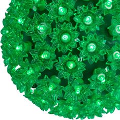 green christmas lights are arranged in the shape of a ball on a white background photo