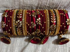 Fashionable, Elegant, Classy And Delicate Designer Silk Thread Bangles Set which will Add Bling To Your Look. Made Silk Threads, This Set Is Skin Friendly. A breathtakingly beautiful Silk Thread Bangles Set, elegant and grand, Nice to wear during wedding, engagement, festival & all traditional occasions, this armlet is crafted to enhance your dazzling appeal while you flaunt your traditional look. Brand -Saumakshi Designs is a leading brand of Fashion Jewellery known for its quality products, co Silk Thread Earrings Designs, Silk Thread Necklace, Silk Thread Bangles Design, Silk Bangles, Silk Thread Earrings, Thread Bangles Design, Kundan Bangles, Silk Jewelry, Silk Thread Jewelry