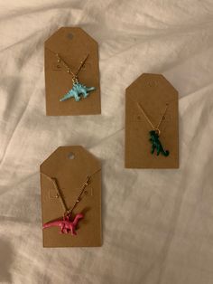 Dinosaur Necklaces available in blue and green. Dinosaur Necklaces, Dinosaur Necklace, Charm Necklaces, Blue And Green, Charm Necklace, Labour Day, Necklace Etsy, Beauty Book, Etsy Accessories