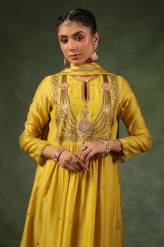 Yellow kurta with sequin, zardozi embroidery on neckline, sleeves and buttis spread all over in floral pattern. Paired with pant and dupatta. - Aza Fashions Traditional Semi-stitched Embellished Palazzo Set, Gold Slub Silk Salwar Kameez With Mirror Work, Embellished Chinon Kurta For Navratri, Yellow Embellished Traditional Anarkali Set, Traditional Yellow Embellished Anarkali Set, Diwali Embellished Chinon Kurta, Traditional Embellished Palazzo Set For Reception, Traditional Yellow Embellished Dupatta, Festive Embellished Yellow Salwar Kameez