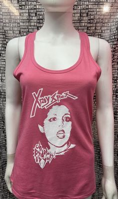 This is a pink with white ink sleeveless long X Ray Spex tank top with racer back. This has a X Ray Spex image screen printed on the front. 60% cotton/ 40% polyesterThese are handmade screenprinted and slightly vary from the photo. Please feel free to email me any questions. Thanks for looking.Due to an influx of incorrect addresses if a package is returned,  you must pay the shipping cost to resend the item to you.I do not do exchanges and I do not take returns unless the item is damaged. I tho Affordable Pink Printed Tank Top, Pink Punk T-shirt For Summer, Fitted Sleeveless Grunge T-shirt, Grunge Tank T-shirt For Summer, Summer Grunge Tank T-shirt, Y2k Graphic Print Racerback Top, Y2k Racerback Top With Graphic Print, Punk Style Sleeveless Stretch Top, Spring Graphic Print Tank Top For Streetwear