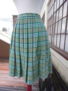 "Vintage 50's-60's perfect wool plaid pleated skirt. Main colors, are cream, teal and green. Great condition; no notable flaws. Hidden zip with button closure. Unlined. Waist:12.25\" across (24.5\" waist, a 25\" waist would be snug but it has a tiny bit of give) Length:21.25\" Hips:open (pleated)" Green Accordion Pleats Skirt, Fitted Green Accordion Pleated Skirt, Retro Green Pleated Skirt, Retro Knee-length Pleated Skirt, Vintage Plaid Full Skirt, Vintage Full Skirt With Accordion Pleats, Vintage Fitted Accordion Pleated Skirt, Vintage Pleated Plaid Skirt, Fitted Vintage Plaid Skirt