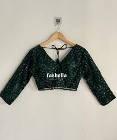 Stunning emerald green/ dark green blouse.  It has thread and transparent sequin embroidery on net fabric. This blouse is a versatile piece and can be paired with saris and lehengas.  DEATILS * V neck font and back * 3/4 th sleeves * Padded * Back hooks for closure This blouse can be made in ANY color. Please send me a convo if you need it in a different color.  MEAUREMENTS & CUSTOMIZATIONS This blouse can be purchased in your standard sizing and pattern. Please choose your Chest Size (measured in inches) from the drop-down box.  For custom sizing please include the below measurements in the the notes to whenever you placed the order.  * Chest size: * Waist size: * Blouse Length: * Sleeve Length: * Bicep: * Arm-hole: * Front Neck Depth: * Back-Neck Depth:  SHIPPING DETAILS  Please leave yo Dark Green Embroidery Blouse, Green Embroidered V-neck Blouse, Festive Green Choli With Unstitched Blouse, Festive Green Unstitched Blouse Choli, Green Anarkali Choli With Unstitched Blouse, Green Long Sleeve Blouse For Wedding, Elegant Green Blouse For Festive Occasions, Green Long Sleeve Wedding Blouse, Elegant Green Festive Blouse