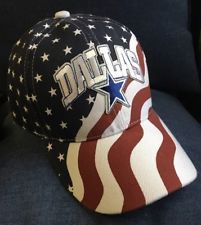 a baseball cap with the word dad written on it and an american flag in the background