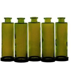 four green glass bottles lined up in a row