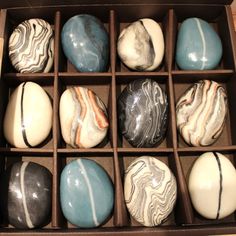 a box filled with different types of marbles