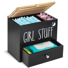 a black box with two compartments and the words girl stuff inside it is filled with files