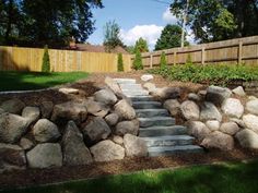 a rock garden with steps leading up to it