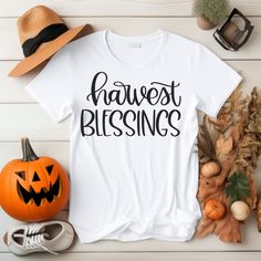 Harvest Blessing: Nature-Inspired T-Shirt Collection for Autumn Comfort "Harvest Blessing" design t-shirt is a special  reflecting the abundance of autumn and the generosity of nature. Crafted from soft cotton in natural tones adorned  it embodies a cozy and warm autumn style. This design, carrying the essence of the season, is ideal for showcasing the rich colors of nature and the serene atmosphere of fall. Discover the "Harvest Blessing" t-shirt  to immerse yourself in nature's embrace and effortlessly blend your style with natural beauty! Features: *Brand of shirts: BELLA CANVAS         * Solid colors: 100% Cotton.          *Heather colors: 52% Cotton + 48% Polyester.          *All types of shirts are very soft.          *The Unisex t-shirts are retail fit and a bit relaxed. Please chec Inspirational Cotton T-shirt For Fall, Patch T Shirt, Cotton T-shirt With Text Print For Fall, Fall Season Fan Merchandise Cotton T-shirt, Fall Relaxed Fit T-shirt With Sublimation Print, Fall T-shirt With Sublimation Print In Relaxed Fit, Colors Of Nature, Blessed Shirt