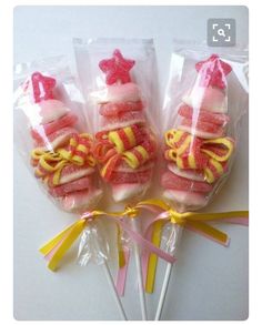 four candy lollipops wrapped in cellophane