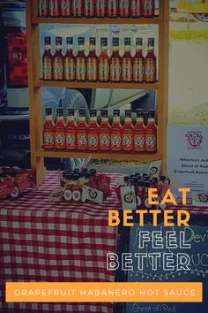 a table topped with bottles of beer next to a red and white checkered table cloth