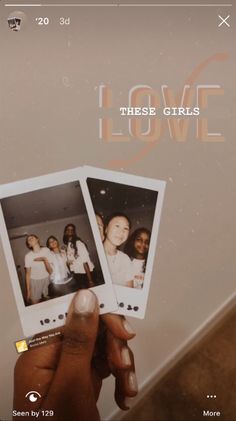 someone holding up two polaroids that say love