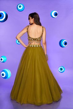 A tulle Lehenga in olive embellished with glass beads, metals, sequins, and 3D embroidered flowers. Paired with an olive raw silk blouse embellished with shell stones, crystals, and metals, and a tulle dupatta.From Papa Don’t Preach’s Nazar Na Lage collection. DELIVERY TIMEPlease allow 8-12 weeks for your outfit to arrive. FABRIC DETAILSTulle, Raw Silk. Professional cleaning only. Raw Silk, Embroidered Flowers, Silk Blouse, Lehenga, Formal Dresses Long, Glass Beads, Silk, Formal Dresses, Fabric