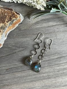 This is a very pretty pair of dangle earrings. The chain is shiny blackened silver and goes really well with the labradorite drops. Finished with silver plated fish hook ear wires. They measure 2 3/4" overall.  #beadedartbyv #beadedearrings #beadedjewelry #HandCraftedJewelry #artisanjewelry #artisanmade #labrodoriteearrings Gray Sterling Silver Dangle Jewelry, Sterling Silver Gray Dangle Jewelry, Nickel-free Labradorite Dangle Earrings, Nickel Free Silver Labradorite Earrings, Gray Sterling Silver Dangle Earrings, Labradorite Earrings, Artisan Craft, Fish Hook, Artisan Jewelry