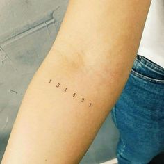 a person with a small tattoo on their arm