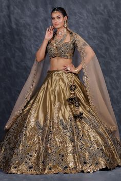 Olive green flared tissue organza kalidar lehenga with contrasting black velvet patch ambrosia embroidery and gota lace bloom highlights. Paired with a matching embroidered flattering Queen Anne neck blouse and a spluttered mukaish embellished cutwork bloom border organza dupatta. - Aza Fashions Silk Choli With Intricate Embroidery For Party, Party Wear Sharara In Tissue Silk With Traditional Drape, Navratri Organza Dresses With Sheer Dupatta, Anarkali Traditional Wear With Unstitched Organza Blouse, Silk Lehenga With Zari Work For Party, Festive Organza Anarkali Set With Unstitched Blouse, Festive Anarkali Set With Unstitched Blouse In Organza, Gold Cutdana Gown For Navratri, Transitional Tissue Silk Dress With Zari Work