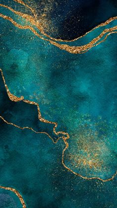 an abstract painting with gold glitters on the water's blue and green surface