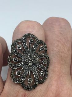 Vintage ring surrounded by Swiss cut fine Marcasite Sterling silver Size 7.5 can be sized by my jeweler. His service charge is $10- $15 All rings are shipped in a nice gift box. Check out our over a THOUSAND great reviews Engraving is $4 per letter and is not always perfect depending on the piece. It can take a few days if the jeweler is busy. This is payable to Paypal Judithsltd@gmail.com Antique Silver Diamond Ring With Gemstone, Antique Silver Diamond Ring Collectible, Silver Diamond Ring For Collectors, Hallmarked Silver Oval Flower Ring, Victorian Silver Diamond Ring With Gemstone, Antique Silver Cluster Ring As Gift, Silver Oval Hallmarked Flower Ring, Silver Oval Flower Ring Hallmarked, Victorian Silver Rings For Jewelry Making