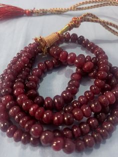 19''AAA 741 Carat Natural Ruby Smooth Rondelle Gemstone Beads Necklace With Adjustable Code Necklace Stone : Ruby Natural Shape :- Smooth rondelle Necklace - 19 inch 2 line string Size :- 4mm to 10mm Weight :- 741 carat Polish :- Handmade color - Red Polish :- Handmade makes a great gift for your loved ones. Click below to see live stock: https://www.etsy.com/au/shop/ShakugemsStore?ref=search_shop_redirect If for any reason you are not satisfied with your purchase. You can return it for a full r Festival Gemstone Bead Round Necklaces, Festival Round Gemstone Beads Necklace, Traditional Rondelle Beaded Necklace With Polished Beads, Traditional Single Strand Rondelle Jewelry, Traditional Round Beaded Necklaces For Formal Occasions, Traditional Round Beaded Necklace For Formal Occasions, Traditional Beaded Necklace For Formal Occasions, Traditional Round Gemstone Beaded Necklaces, Traditional Rondelle Gemstone Beads