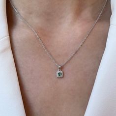 Materials: 14k White Gold Gemstone: Genuine Emerald Total Emerald Carat Weight: 0.07 ct. Total Diamond Carat Weight: 0.09 ct. Pendant Diameter: 11.7mm x 6.2mm Diamond Clarity: SI 1-2 Diamond Color: I color Description: This listing is for the pendant only, the necklace is not included. These are genuine emeralds, not lab grown emeralds. This beautiful piece will not tarnish in the shower and will not irritate the skin. It will arrive in a jewelry box, with a jewelry bag for traveling. Perfect fo Square Pendant Emerald Necklace For May Birthstone, Fine Jewelry Emerald Necklace With Square Pendant, Fine Jewelry Emerald Square Pendant Necklace, Fine Jewelry Emerald Necklace With Square Yellow Gold Pendant, Luxury Emerald Square Pendant Necklace, Temple City, Square Stud, Jewelry Bag, Square Pendant