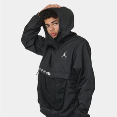 Keep Covered In The Jordan Jumpman Windbreaker. With Hood Features Including A Visor And Toggle Drawcord, Plus A Quarter-Zip To The Front, You Can Style The Coverage To Your Needs. - Reflective Jordan Branding Prints - Quarter-Zip - Hood With Adjustable Toggle Drawcords - Elastic Cuffs And Hem - Zip Pouch Front Pocket - Dual Front Pockets - Mesh Lining - Regular Fit - Composition: 100% Polyester - Colour: Black/Black - Style: Dj0246-010 Windproof Outerwear For Streetwear In Sportswear Style, Winter Windbreaker For Streetwear In Sportswear Style, Winter Sportswear Windbreaker For Streetwear, Winter Streetwear Windbreaker In Sportswear Style, Urban Style Black Track Jacket For Outdoor Activities, Black Techwear Windbreaker For Sports, Black Urban Hooded Track Jacket, Black Hooded Urban Track Jacket, Black Athleisure Outerwear For Hiking