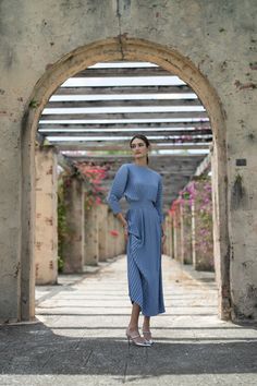 The Zarah Dress in Steel Blue is a timeless and elegant choice for any evening occasion. Made from pleated crepe, this dress drapes beautifully and flatters all body types. With a hidden zipper at the back, it provides a seamless and polished look. Dress it up or down, and pair with a belt (sold separately) for added definition. Product Details Lightweight Pleated Crepe Fabric Fitted Waist Hidden Zipper at Center Back Model Model is 5'10" and wearing size S. Elegant Floor-length Dress With Accordion Pleats, Evening Maxi Dress With Accordion Pleats, Midi Pleated Dress With Pleated Back For Gala, Pleated Draped Gala Dress, Midi Length Evening Dress With Pleated Back, Pleated Draped Dress For Gala, Accordion Pleated Maxi Dress For Evening, Draped Midi Dress With Pleats For Gala, Elegant Maxi Dress With Folds For Evening