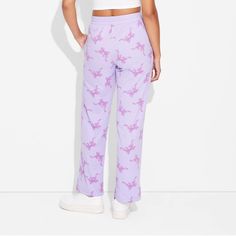 Step out in style with the Women's Self Love Bow Cozy Graphic Pants – Purple. Crafted from a comfortable blend of cotton and polyester, these pants are suitable for all-day wear. The jersey fabric provides a soft feel, while the midweight design ensures year-round comfort. With their straight-leg fit, these pants offer a flattering and on-trend look. Whether you're running errands or relaxing at home, these pants are sure to become a wardrobe staple. Casual Sweatpants For Pajama Party In Spring, Casual Spring Sweatpants For Pajama Party, Casual Sweatpants With Elastic Waistband For Pajama Party, High-waisted Cotton Leisure Pants, Casual Cotton Pants For Pajama Party, Casual Cotton Pajama Party Pants, Casual Wide-leg Pants For Pajama Party, Casual Straight Pants For Pajama Party, Casual Purple Sweatpants For Loungewear