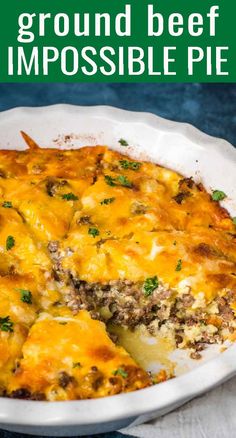 a casserole dish with cheese and ground beef in it on a white plate