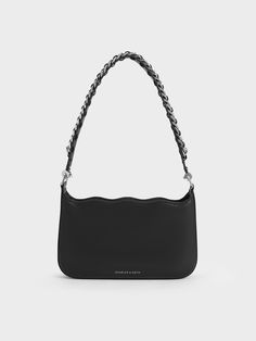 This product is made with at least 20% sustainable materials by weight. CHARLES & KEITH uses recycled, degradable, organic, and water-based materials in our eco-conscious collection.A classic shoulder bag with a refreshing twist -- this piece boasts a wavy silhouette at the top, highlighted by a striking braided chain-link handle. In timeless black, it will effortlessly complement any ensemble. For added versatility, swap out the chain handle for the detachable strap and sling it across your bod Wallet Gifts, Charles Keith, Sustainable Materials, Sales Gifts, Chain Link, Winter Outfits, Braids, Bag Lady, Twist