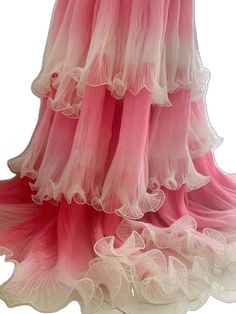 a pink and white tiered skirt with ruffles on the bottom is shown