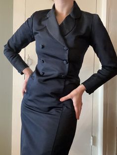 "1980s designer Bill Blass for I. Magnin deep navy blue silk tuxedo jacket style dress.  Nice heavy weight, feels very secure and luxurious when worn. Features a classic blazer lapel, double-breasted front buttons, buttons on the sleeve cuffs, and a kick pleat in the back. Condition is excellent, no flaws found. Fits an XS -- S; best for up to 33\" bust if fully buttoned, (top button could be worn undone and then should work for up to 35\") up to 28\" waist, up to 36\" hip, 37\" long" Luxury Classic Blazer Dress With Button-up, Luxury Tuxedo Blazer Dress With Lapel Collar, Luxury Tuxedo Blazer With Hidden Button Closure, Luxury Navy Double-breasted Blazer, Luxury Classic Blazer Dress For Work, Luxury Classic Button-up Blazer Dress, Luxury Double-breasted Fitted Blazer Dress, Classic Luxury Long Sleeve Tuxedo, Luxury Fitted Double-breasted Blazer Dress