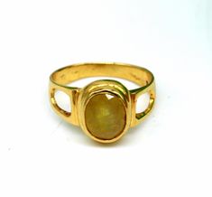 18karat yellow gold gorgeous  yellow sapphire (pukhraj stone) handmade tribal ring band jewelry, best astrological gift for unisex. weight- 6.190 grams approx. metal-yellow gold. metal purity- 18 karat. brand-handmade. Stone-yellow sapphire stone(Pukhraj)  hallmarked- 916- stamp. size-select size. weight of ring may be increase or decrease according to size. note-gold jewelry is handmade designer jewelry . so there can be slight difference in size and weight of the article in the comparison of the description. please see the photos for more details.' Gold Sapphire Ring With Gemstone, Gold Oval Yellow Sapphire Ring, Yellow Gold Oval Jewelry With Simple Design, Gold Yellow Sapphire Round Ring, Oval Yellow Gold Jewelry With Simple Design, Simple Oval Yellow Gold Jewelry, 22k Gold Bezel Setting Jewelry Gift, 22k Gold Jewelry With Bezel Setting Gift, Gold Round Yellow Sapphire Ring