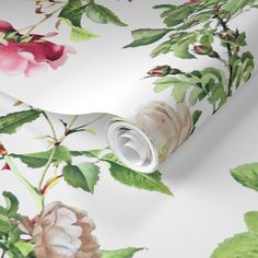 a white floral wallpaper with pink and green flowers on the bottom half of it