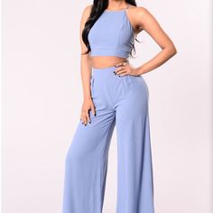 Beautiful Two Piece Set Size X Small New With Tags Crop Halter Top With Lace Up Detail. Wide Leg Pants Perfect For Any Occasion Wide Leg Blue Jumpsuit For Day Out, Blue Wide-leg Jumpsuits And Rompers For Day Out, Sleeveless Blue Pantsuit For Summer, Chic Blue Wide Leg Jumpsuits And Rompers, Chic Blue Wide-leg Jumpsuits And Rompers, Chic Blue Bottoms For Date Night, Blue Stretch Cropped Bottoms, Chic Blue High-waist Jumpsuits And Rompers, Chic High Waist Blue Jumpsuits And Rompers