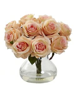 a vase filled with lots of pink roses