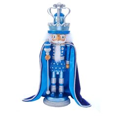 a blue and white figurine with a crown on top