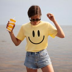 You will love this vintage happy face tshirt! These smiley tees are so soft and comfortable so they're great for lounging at home or running around doing errands! These retro smile face shirts make great gifts for your bestie, daughter, sister or anyone who loves giving off happy, positive vibes! These t-shirts are not made as an oversized fit so please make sure to check the size chart and order up a few sizes if you are looking for that baggier fit! *PRODUCT DESCRIPTION* -Bella+Canvas 3001 Unisex Jersey Short Sleeve Tee -100% cotton (fiber content may vary for different colours) -Light fabric -Tear-away label -Shirt colour may vary slightly due to variations in lighting and monitor brightness *SIZING* -Retail fit (slightly fitted) -Runs true to size -See size guide in product photos for Smiley Face Tshirt Ideas, Smiley Face Shirts, Positive T Shirts, Vintage Smiley Face, Aesthetic Smile, Yellow Tshirt, Smiley Face Tshirt, Label Shirt, Funny Bride