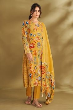 Dandelion yellow A-line kurta with ikat, floral print and gold embroidery in center panel. Paired with narrow pant and gota embroidered dupatta. - Aza Fashions Yellow Anarkali Palazzo Set With Printed Motifs, Yellow Palazzo Set With Printed Motifs For Navratri, Navratri Yellow Palazzo Set With Printed Motifs, Designer Yellow Kurta With Printed Motifs, Designer Yellow Palazzo Set With Printed Motifs, Designer Wear Yellow Kurta With Printed Motifs, Yellow Salwar Kameez With Printed Motifs For Navratri, Yellow Navratri Salwar Kameez With Printed Motifs, Yellow Silk Sets With Printed Motifs