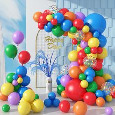 a bunch of balloons that are in front of a sign with the words happy birthday written on it