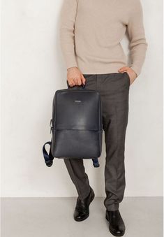 Our men's backpack combines classic and modern design. The accessory is made of smooth natural black leather.The appearance of the backpack does not oblige you to adhere to a certain style of clothing. That allows you to use this accessory for various purposes: business meetings, trips, walks with friends. The backpack has a concise design, keeps its shape well and is quite resistant to deformation.The large main compartment closes with a zipper. The lining material is made of durable fabric.Ins Walks With Friends, Business Backpack Women, Leather Backpack For Men, Business Backpack, Classic Office, Unisex Backpack, Belt Purse, Unique Bags, Men's Backpack