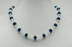 Length: 47 cm, weight: 20 gr. Closure: Rhinestone plug closure Royal blue glass crystals alternating with transparent glass crystals bring liveliness to the outfit. This necklace is unique and carefully handmade. (40098) Prices are total prices. Exempt from VAT according to § 6 Abs. 1 Z 27 UStG 1994 AT. Blue Beaded Crystal Necklace, Blue Crystal Necklaces With Round Glass Beads, Blue Crystal Necklaces For Gifts, Blue Crystal Necklaces As A Gift, Blue Round Beaded Glass Crystal Necklace, Blue Crystal Necklace As Gift, Blue Crystal Necklace Gift, Blue Glass Crystal Necklace With Round Beads, Blue Crystal Necklaces With Faceted Beads