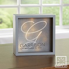 the personalized glass block is displayed in front of a window