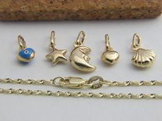 Real 14k Twisted Rope Chain with Lobster Clasp & charms / Pendants Length : from 12 to 24 inches  metal : solid 14k gold  weight :  from 1 gram to 2.5 gram ( depending on length) A beautiful chain with lobster clasp for adults as well kids !  Please free to ask any questions ! Gold Rope Chain Necklace With Lobster Clasp As Gift, Party Gold-tone Chain Necklace With Lobster Clasp, Adjustable Gold-tone Charm Necklace With Lobster Clasp, Gold-tone Metal Charm Necklace With Lobster Clasp, Gold-tone Chain Necklace With Lobster Clasp And Round Pendant, Rope Chain, Chain Pendants, Niagara Falls, Chains Necklace