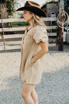 Get ready to turn heads in The Kerri Dress! This western-inspired mini dress features a caramel hue, collared button down placket, and short puff sleeves. With a relaxed silhouette and front flap and side seam pockets, it's as functional as it is stylish. The washed denim adds a touch of vintage charm, making it perfect for the fall season. Courtney is wearing size small paired with the Felt Cowboy ProHat Collared Mini Dress With Pockets For Work, Collared Cotton Mini Dress With Pockets, Casual Mini Dress With Pockets And Short Sleeves, Collared Mini Dress With Pockets For Fall, Fall Collared Mini Dress With Pockets, Mini Shirt Dress With Pockets For Day Out, Fall Beige Shirt Dress With Pockets, Chic Mini Dress With Pockets And Relaxed Fit, Beige Shirt Dress With Pockets For Fall